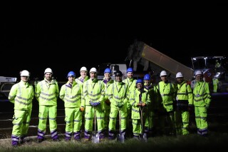 The team from VolkerFitzpatrick, Heathrow Airport and Jacobs line up for a photocall ahead of night work starting