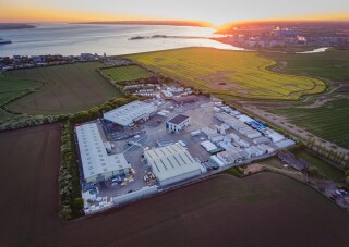 An aerial view of Integra Buildings’ site at Paull, close to the Humber estuary, with the land earmarked for expansion in the foreground. (Photo: Craig Marriott)