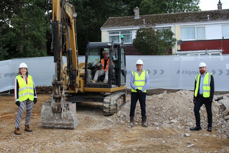 Councillors Theresa Higgins and Adam Fox meet Amplis site manager Michael Manning (centre) as construction work begins at Hardings Close in Aldham