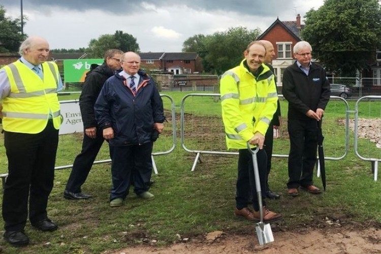 Environment Agency chief executive Sir James Bevan puts the first spade in the ground on 31st July 2019 at Walkmill Crescent, near Botcherby Bridge in Carlisle