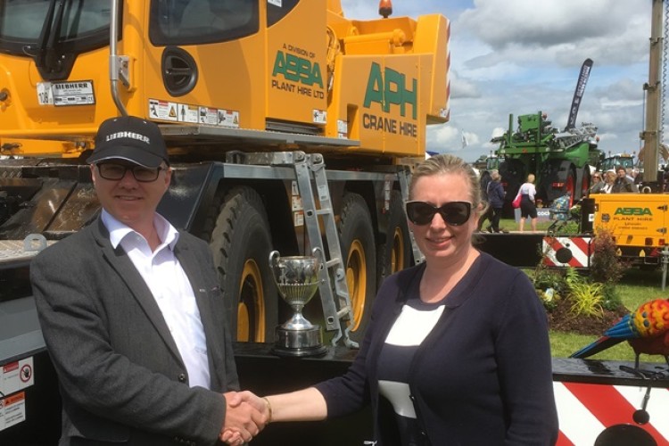 APH displayed its new crane at the Lincolnshire Show &ndash; pictured are Steve Elliott from Liebherr and APH boss Tracey Bourne