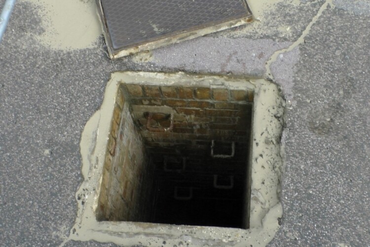 A generic open manhole that someone could fall into; not the actual one at Hanover Court 