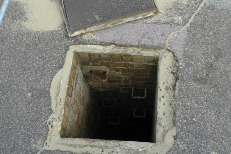 A generic open manhole that someone could fall into; not the actual one at Hanover Court