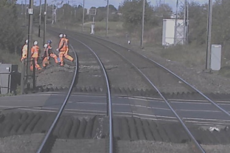 Forward facing CCTV image from a train shows of a near miss with track workers at Egmanton level crossing in Nottinghamshire, 5th October 2017