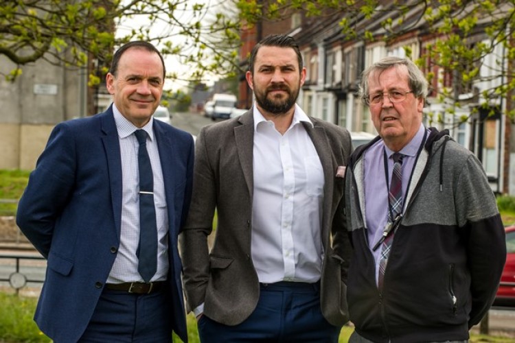 Former boxer Paul Smith (centre) flanked by Mark Kitts of Liverpool Foundation Homes (left) and Cllr Joe Hanson (right)