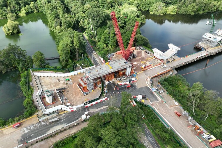 Deck sections are lifted into place over Moorhall Road