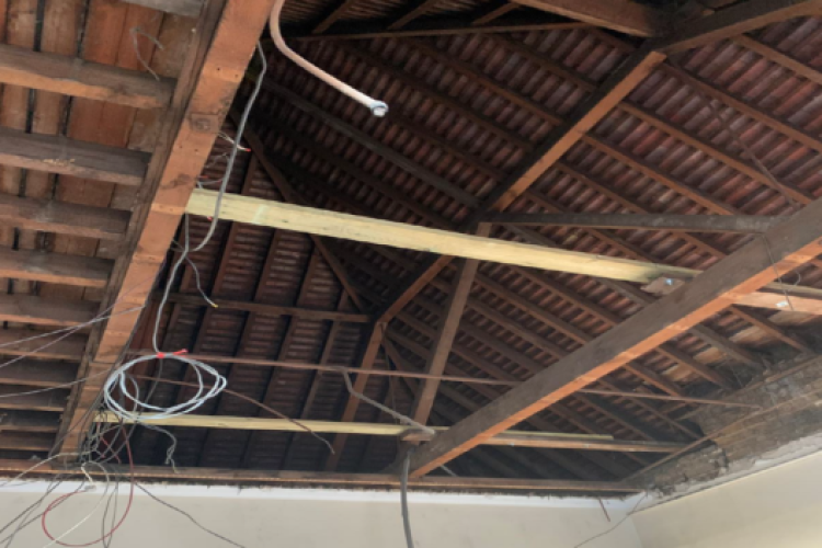 The ceiling of the classroom collapse under the weight of old furniture stored in the loft above
