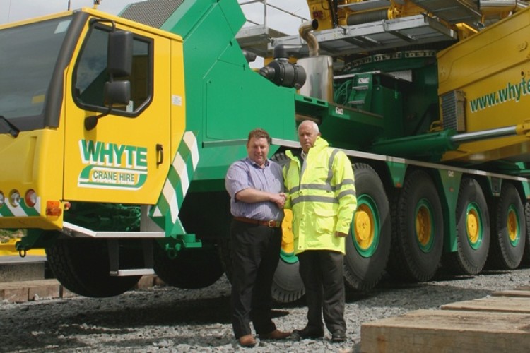 Lawrence Whyte takes delivery of his new LG 1750 from Liebherr's Willie Wylie