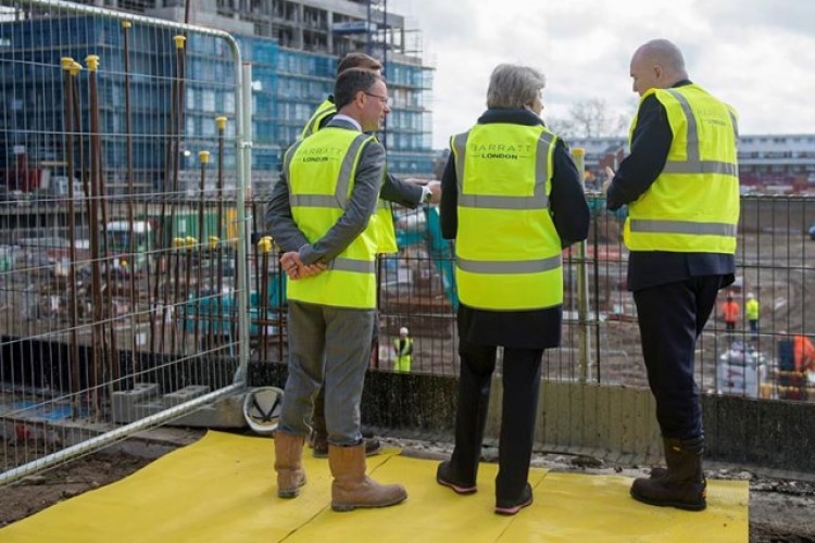 Prime minister Theresa May visits a building site