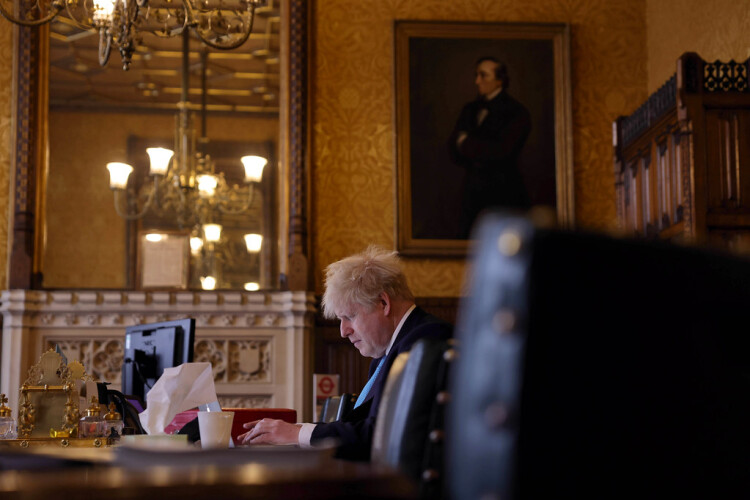 The prime minister checks his script