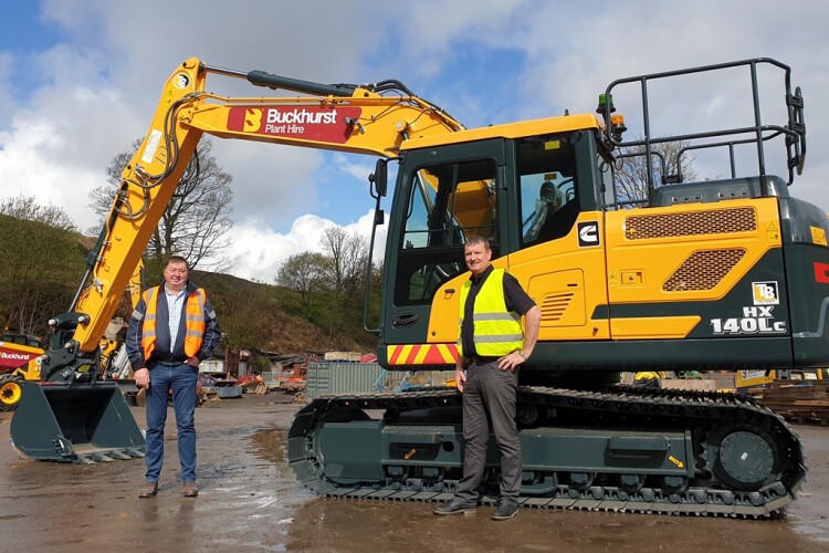 John Walsh of Buckhurst Plant Hire (left) and Taylor & Braithwaite sales director Ian Burton with the 100th Hyundai machine