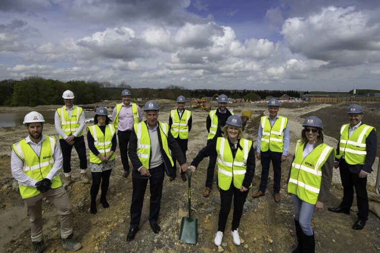 Representatives from the contractor, developer and end-user tenant gather on site to celebrate the start of works