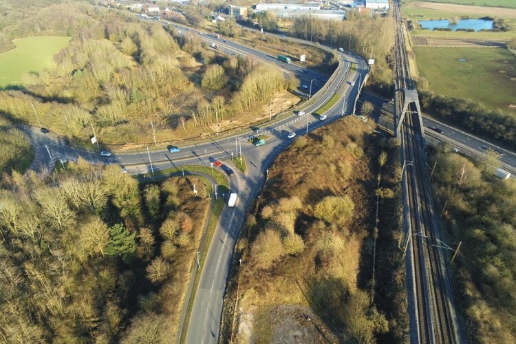 The new bridge will be built just to the left of the road bridge shown in this photo. The old bridge will then be removed.