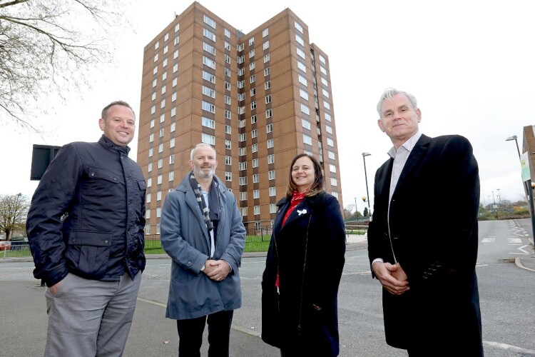 YHN director David Langhorne, Equans regional MD Will Kay, Newcastle councillor Clare Penny-Evans and Equans regional sustainability director Tim Wood in front of a West Denton tower block