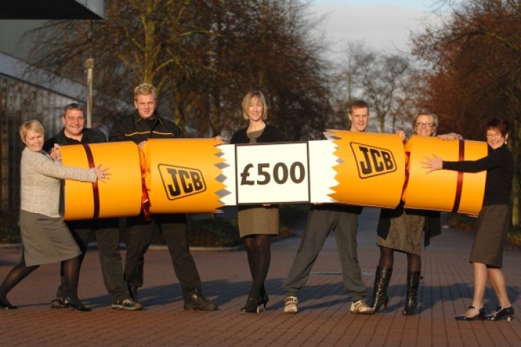 Hurrah! JCB employees celebrate. (l-r: Claire Garner, Hayden Whitehurst, Oli Withington, Jane Cornwall, Ryan Hepburn, Dawn Brian and Denise Taylor.)