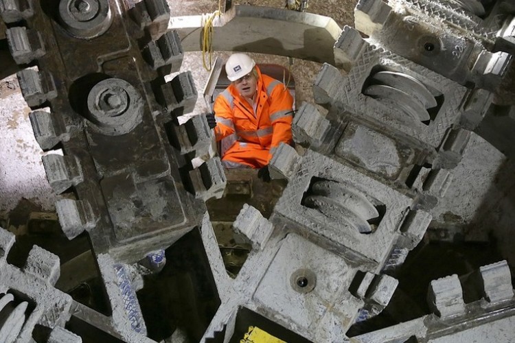 Never one to miss a good photo stunt, London mayor Boris Johnson clambers over one of the TBMs