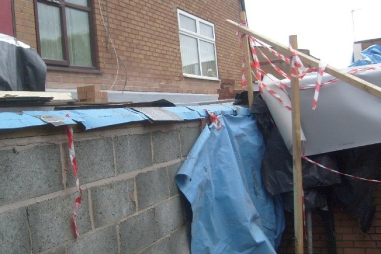 The collapsed handrail which led to two workers falling from the roof at Barlow Moor High School