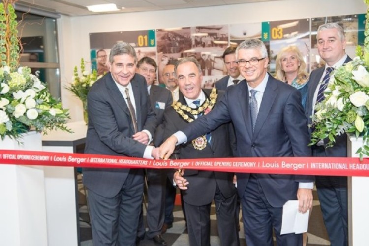 Louis Berger international president Tom Topolski (left), Richmond mayor David Linnette and Louis Berger CEO Jim Stamatis cut the ribbon at the new international HQ