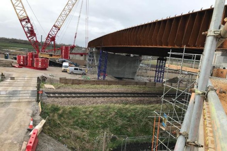 The 350-tonne steel beams, which form the bridge deck, have been lifted into place