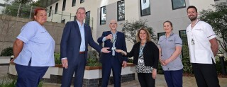LUHFT chair Sue Musson and chief executive James Sumner are handed the keys to the new Royal Liverpool University Hospital