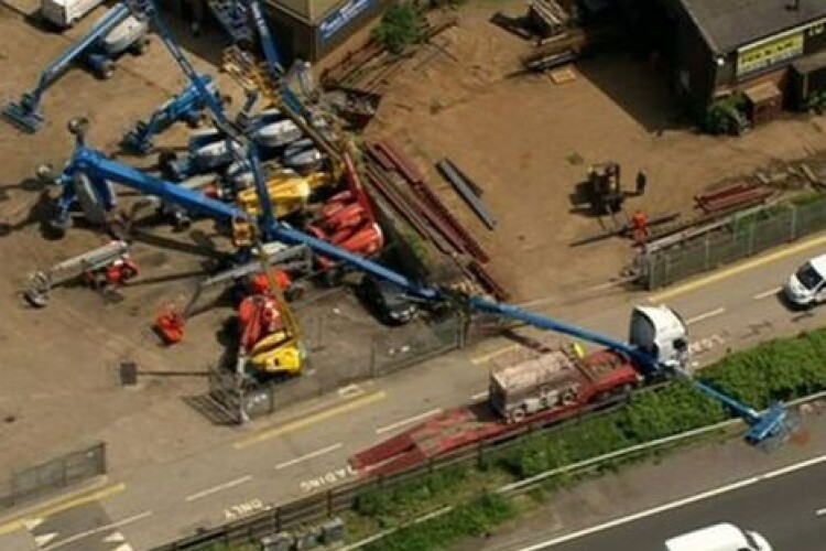The platform landed toppled over the fence and onto the hard shoulder of the M25