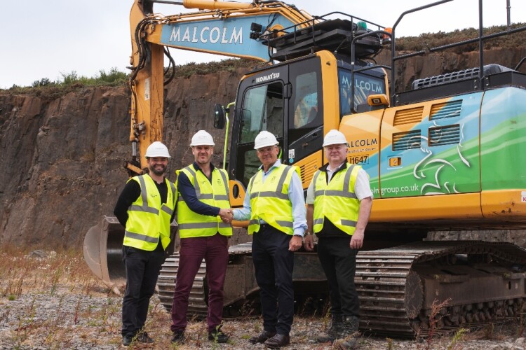 Client Andy Hadden (second left) shakes hands with Malcolm Construction md Walter Malcolm as work starts on site. Chris Bain and Jim McAlister look on.