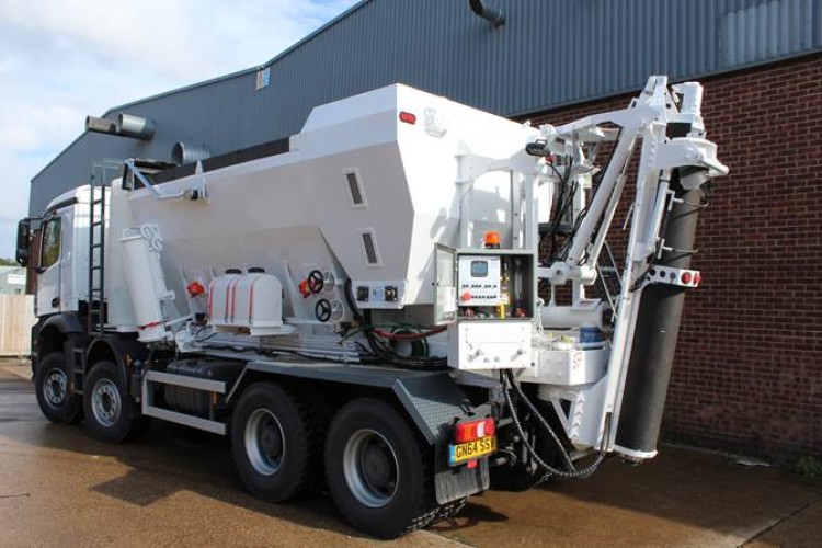 A volumetric concrete mixer