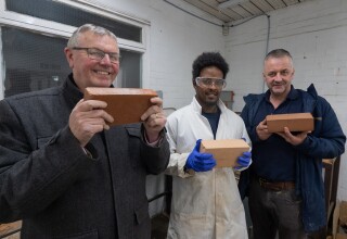 Bob Borthwick, Feysal Shifa and Peter Scott with the prototype bricks two years ago