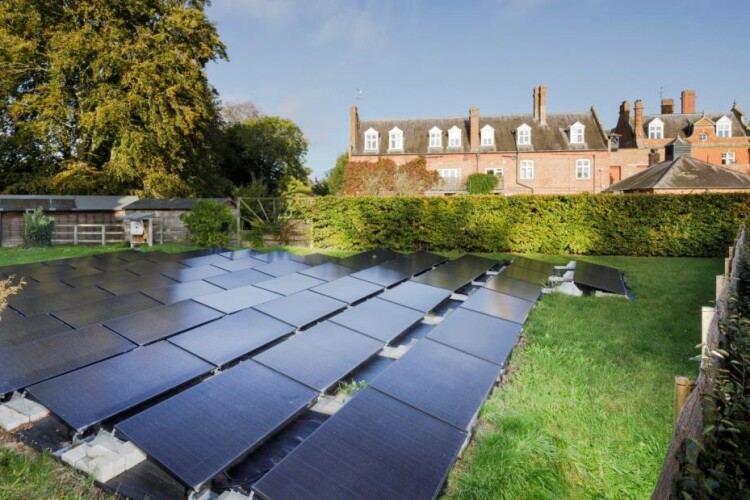 Chippenham Hall in Chippenham, Cambridgeshire, has its solar panels in the garden [Photo from Historic England Archive]