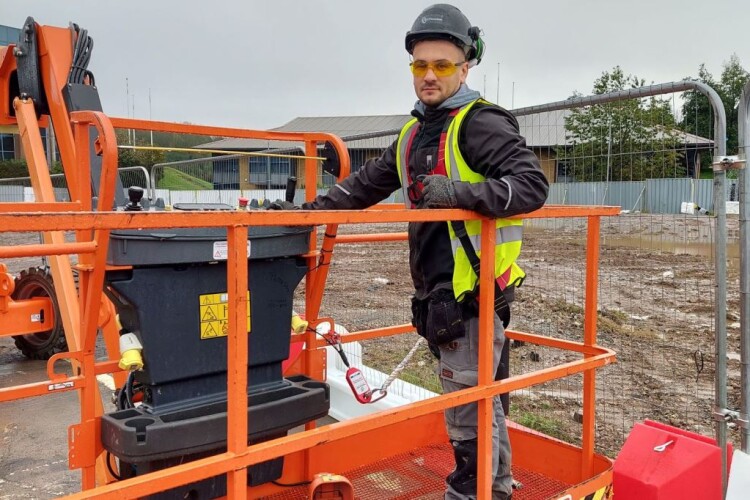 This boom lift operator's harness lanyard is attached to an intelligent anchoring point. Without this connection, the control panel is immobilised