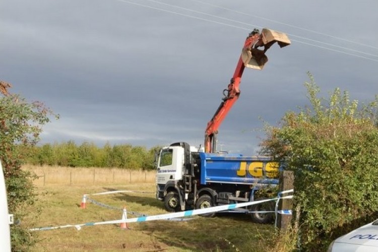 The grab crane touched an 11kv overhead power line, killing the operator