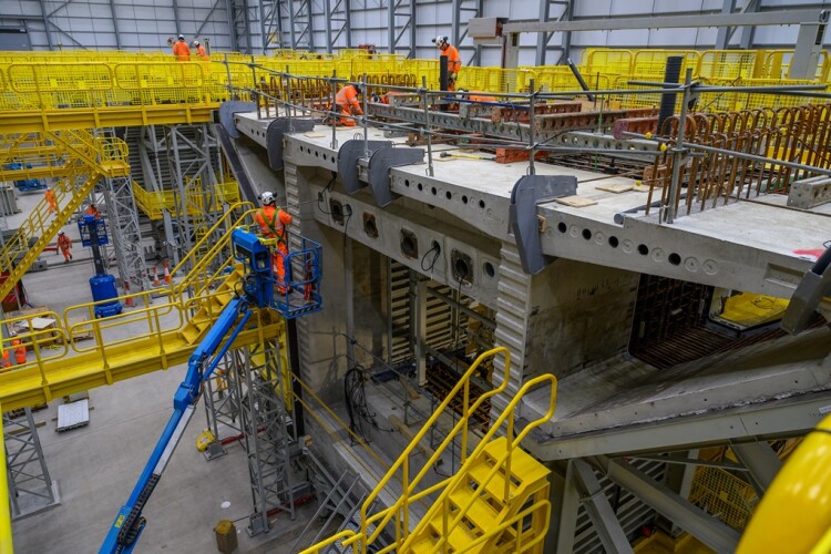 Workers check the first segment of the Colne Valley Viaduct 