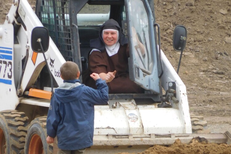 The nuns' new home brings them closer to the community. This is Sister Terezka at the controls.