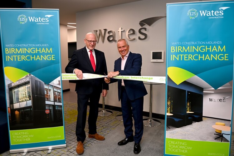 Wates Construction regional director John Carlin (left) and  managing director Paul Chandler declare the new office open at a ribbon-cutting event on 16th February