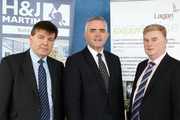 Derek Martin (left) and Colin Loughran (right) flank Northern Ireland Executive junior minister Jonathan Bell