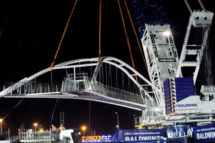 The lift of the Seabraes pedestrian bridge in progress