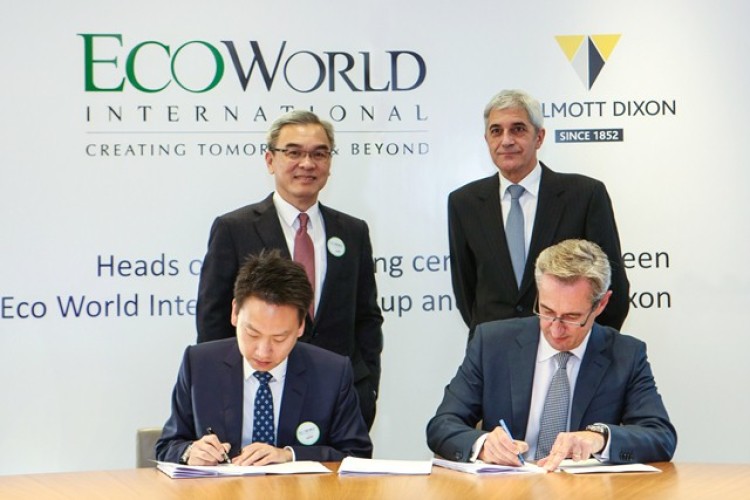 Rick Willmott, front right, and chairman Colin Enticknap, back right, from Willmott Dixon join EcoWorld chairman Tan Sri Dato' Sri Liew Kee Sin, back left, and chief executive Cheong Heng Leong for the signing