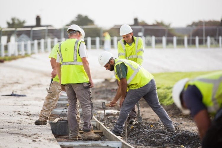 Concrete was poured into a series of bays to create the banked track