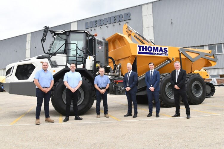 Official handover of Thomas Plant Hire&rsquo;s first TA 230 dump truck. Left to right are Daniel Sullivan, Gwyn Thomas and Wyn Thomas of Thomas Plant Hire; Lee Palmer, Richard Gee and Michael Atkinson of Liebherr GB 