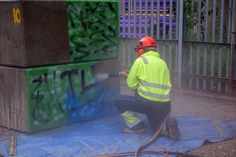 Recent trials at Spaghetti Junction included this system, which blasts off the graffiti with recycled glass pellets