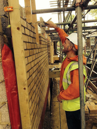 Head bricklayer Jason Lewin at work on the Chiswick site