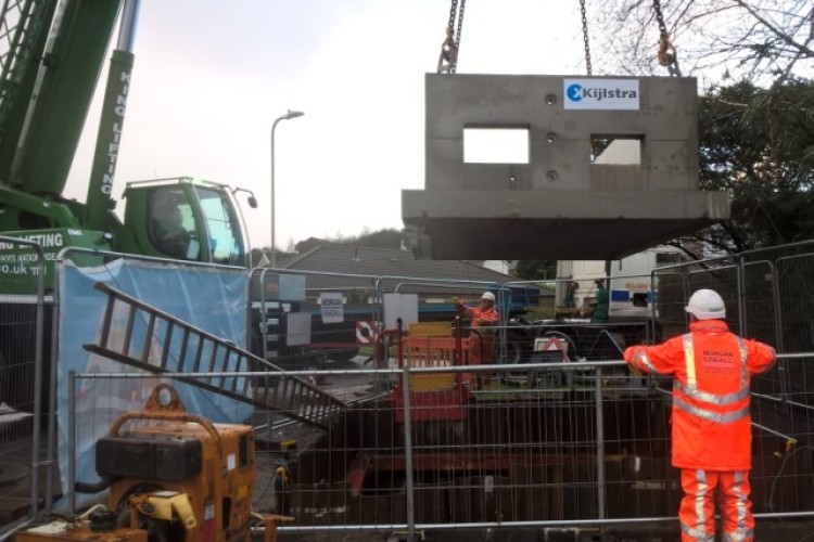 A 60-tonne crane lifts in the 17-tonne precast chamber