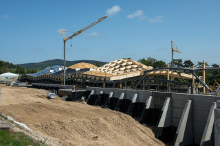 A 12m-high concrete retaining wall was built to allow the distillery to 'emerge' from the hillside