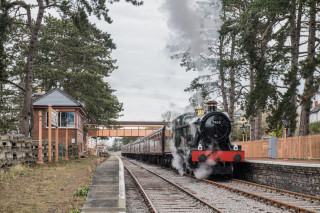 The first train steams into the completed Broadway station