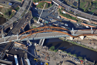 The Ordsall Chord spans the river Irwell in Manchester on a striking asymmetric arch bridge