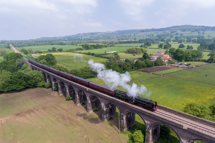 Britannia-class engine Oliver Cromwell pulls a train across Stanway viaduct during this year's Cotswold Festival of Steam. The Broadway extension stretches away in the distance