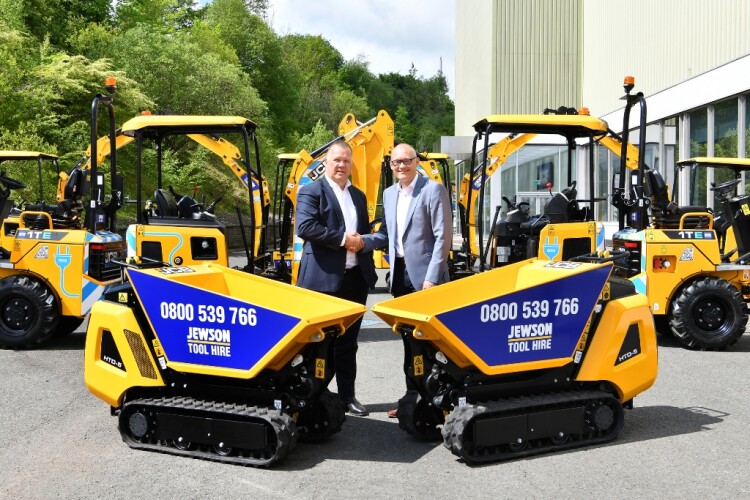 JCB global major accounts managing director Steve Fox (left) with Jewson business development director Mark Esling and some of the new machines