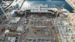 The first of the roof trusses is assembled within the stadium area prior to being lifted above the intimidating south stand.