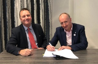John Homer (left) and David Owen sign the deal