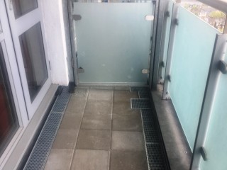 The baclonies are now getting slip-resistant concrete tiles instead